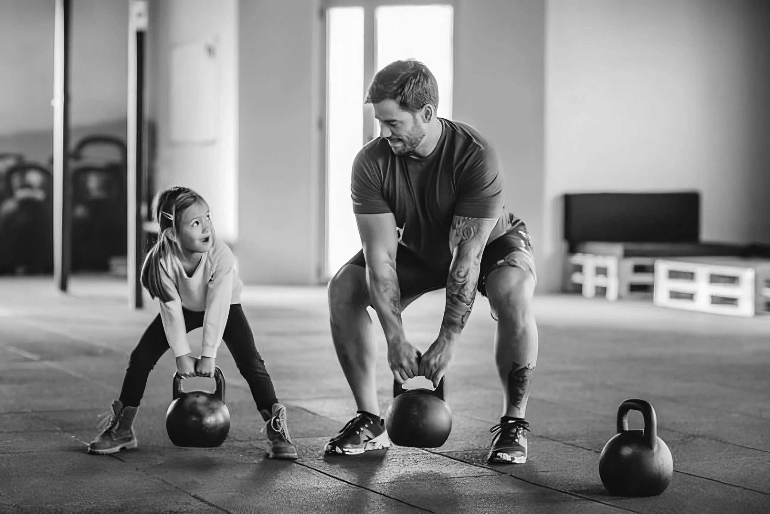 Personal trainer guiding a child through exercises at Forge Athletics in Naples, FL
