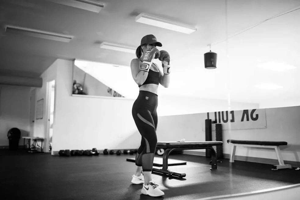 Forge Athletics female client is ready to box it out in her personal training session in Naples, FL