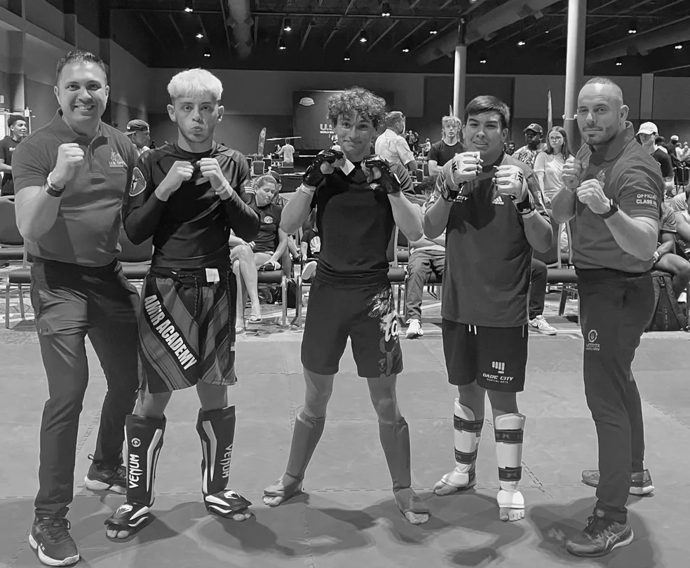 Happy young athlete from Forge Athletics in Naples, FL winning US Open MMA competition